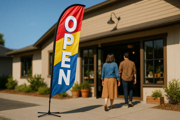 Small business storefront with single feather flag displaying OPEN message at entrance