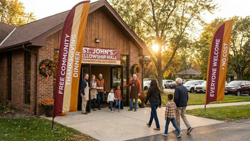 Warm church fellowship hall entrance with welcoming free community Thanksgiving dinner feather banners