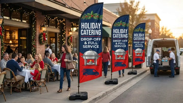 Office park commercial avenue with Holiday Catering Drop-Off & Full Service feather flag catching commuter eye