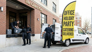 Commercial feather flag displaying Office Holiday Party Catering Delivered outside restaurant takeout entrance