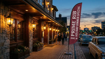 Commercial feather flag promoting Prime Rib Holiday Dinner Special Dine In outside traditional steakhouse