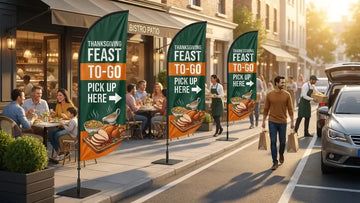 Organized restaurant parking lot with Thanksgiving Feast To-Go feather flags directing pickup vehicle lanes