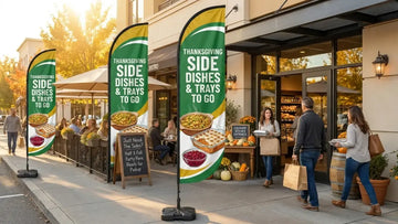 Bistro sidewalk display with Thanksgiving Side Dishes & Trays To Go feather flag attracting passing vehicles