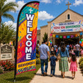 Bilingual church feather flag with WELCOME and BIENVENIDOS text outside a Hispanic ministry church event
