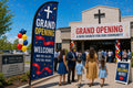 Grand Opening / New Church Plant church feather flag at parking lot entrance guiding first-time visitors