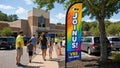 VBS Join Us church feather flag guiding families from parking lot to kids ministry entrance