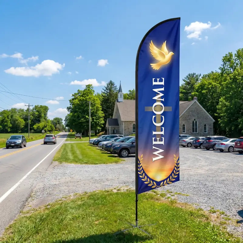 Welcome church feather flag at roadside driveway entrance of rural church visible to passing traffic