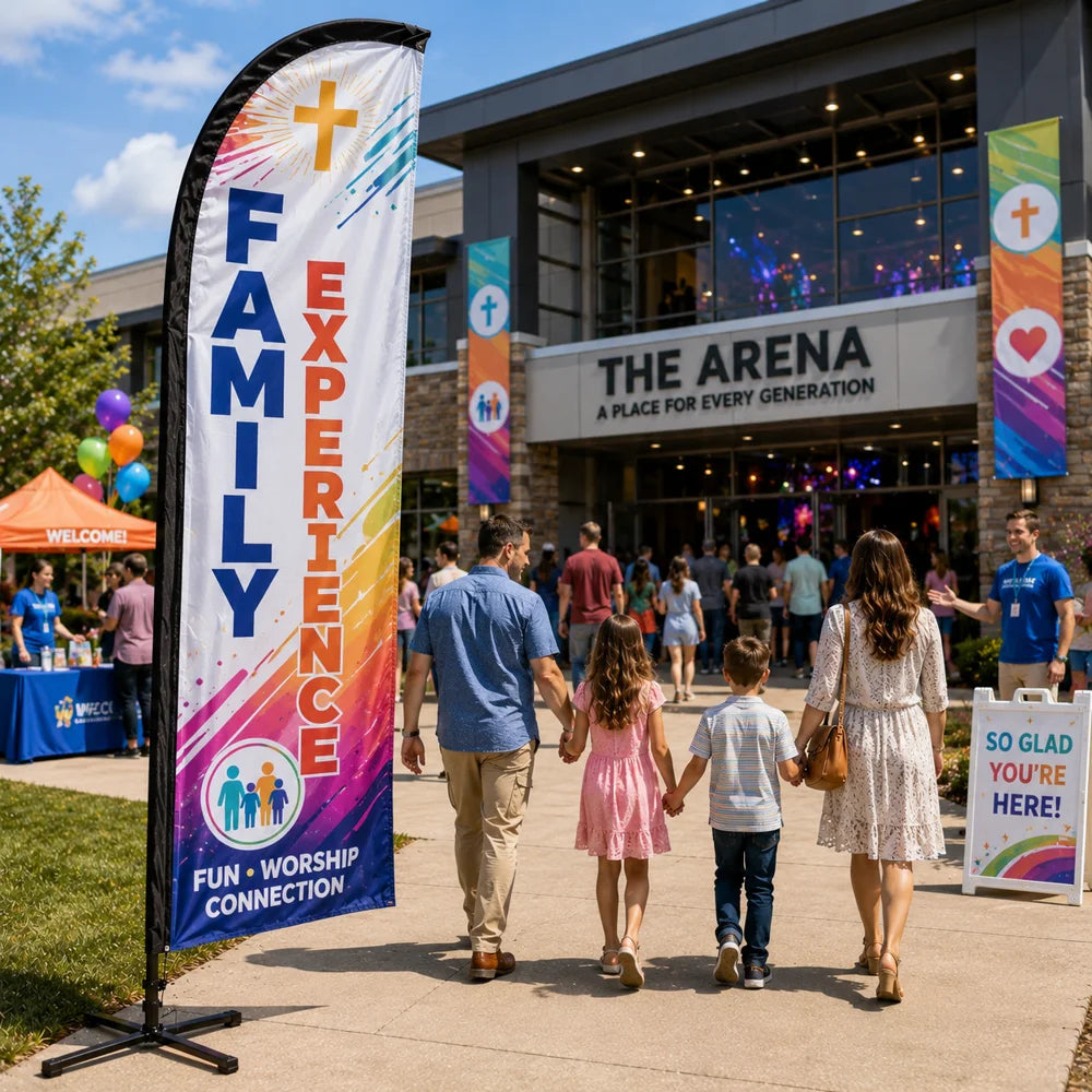 Family Experience church feather flag on a church plaza with families arriving for a multi-generational ministry event