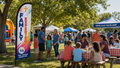 Family Experience church feather flag at an outdoor church event with families and children