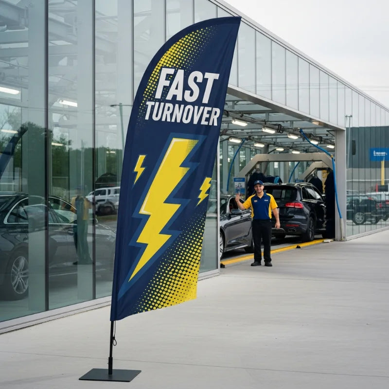 Modern lightning bolt design feather flag promoting fast turnover and efficiency at a busy car wash tunnel.