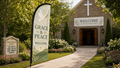 Grace and Peace church feather flag in a peaceful church garden entrance