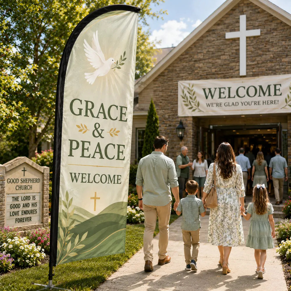 Grace and Peace church feather flag with dove design near a peaceful church garden entrance