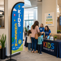 Kids ministry check-in feather flag inside church lobby