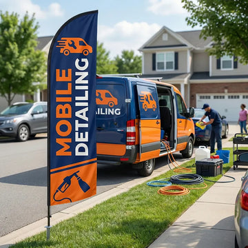 Mobile detailing service feather flag on a wheel-base mount, used at a residential curbside during an on-site detailing appointment.