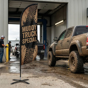Rugged Muddy Truck Special feather flag with tire tread graphics designed for off-road vehicle enthusiasts.