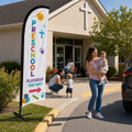 Preschool and playgroup directional church feather flag near nursery drop-off