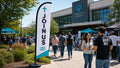 church feather flag with modern campus New Here Join Us theme at church entrance, case study 3