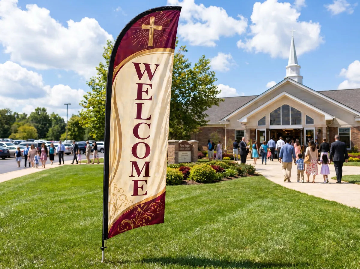 Welcome feather flag for church placed roadside 500ft before entrance visible to passing traffic on Sunday morning