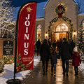 church feather flag with Christmas Join Us theme outside holiday church night service