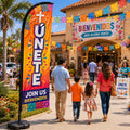 church feather flag with Hispanic ministry Unete theme outside bilingual church gathering