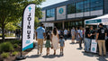 church feather flag with modern campus New Here Join Us theme at church entrance, case study 2