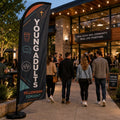 Young Adults Fellowship church feather flag at an outdoor church cafe during a fellowship event