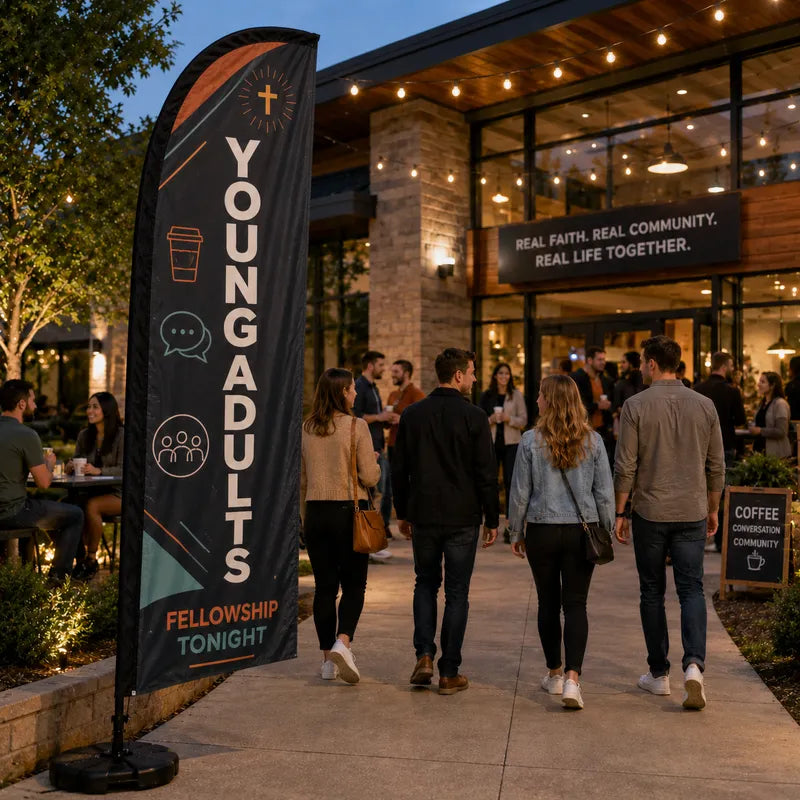 Young Adults Fellowship church feather flag in a modern church courtyard with young adults socializing