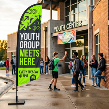 Neon green Youth Group Meets Here feather flag marking the student ministry entrance of a church.